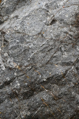 Rock texture and surface background. Cracked and weathered natural stone background.