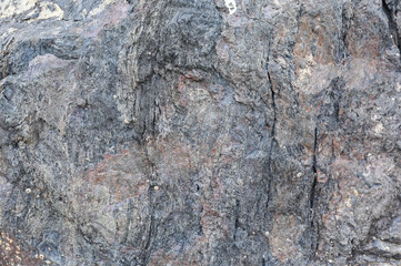 Rock texture and surface background. Cracked and weathered natural stone background.