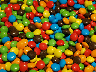 Fototapeta na wymiar Lot of colorful chocolate drops