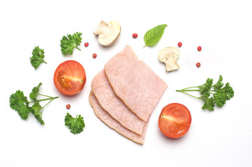 slices of pork and sliced tomato and mushrooms champignon next parsley and red pepper peas on white background
