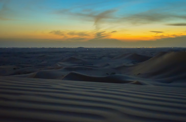 Endless desert sand dunes at sunset near Abu Dhabi