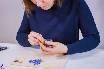 Designer making handmade brooch