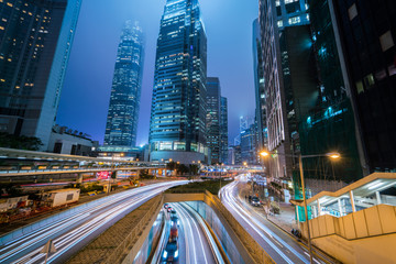 Fototapeta na wymiar Central business district with traffic lights trail and modern business tower at Hong Kong city night.