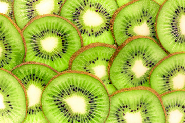 Kiwi slices. Fruit green background. Vegetarian, healthy, organic food. Fresh vitamin nutrition.