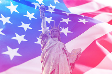 Double exposure of American flag and statue of liberty. Independence day or Memorial day concept.