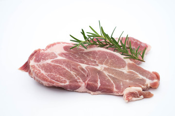 resh raw pork neck meat pepper and rosemary isolated on white
