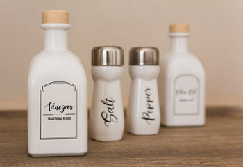 bottles with vinegar, oil, pepper, salt