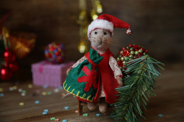 Santa Claus rat with a bag of gifts and Christmas tree. Chinese calendar symbol