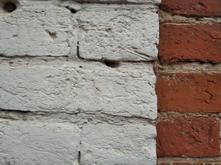 Background of old white and brown bricks. Old fence texture. Grunge background.