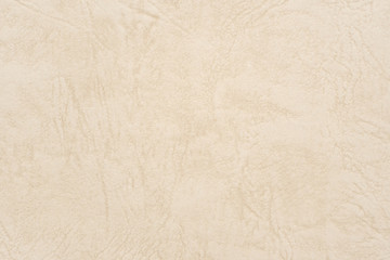 Abstract beige leather texture paper background or backdrop. Empty old cream parchment sheet for decorative design element. Light brown crumpled surface for journal template presentation.