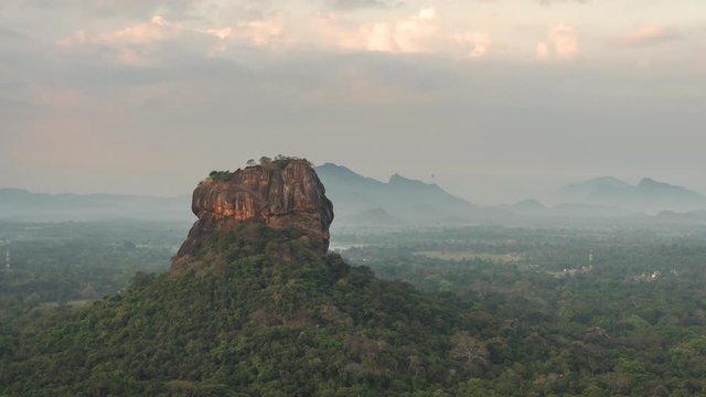 Gorgeous landscape overview of Sigiriya view from Pidurangala rock, Sri Lanka. Misty, fog covering lush tropical jungle landscape scenery.timelapse