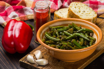 Fried green beans with red pepper, bread, garlic. Vegetarian food.