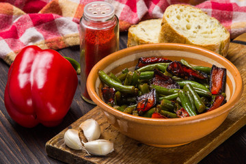Fried green beans with red pepper, bread, garlic. Vegetarian food.