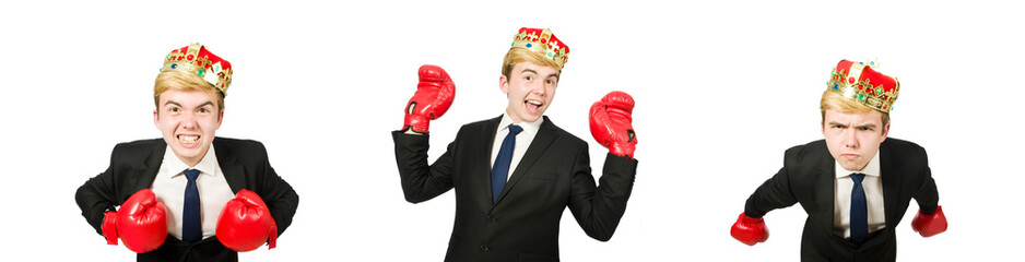 Funny businessman with crown and boxing gloves