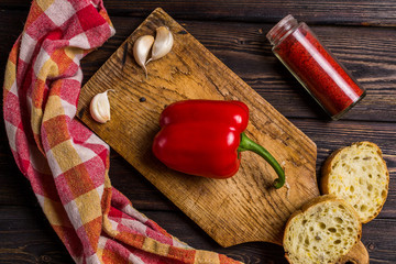 Vegetarian food. Red pepper, bread, garlic. Top View