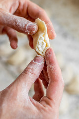 Process of cooking homemade vareniki, Raw dumplings with cottage cheese. Top view.