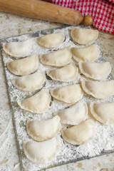 Process of cooking homemade vareniki, Raw dumplings with cottage cheese. Top view.