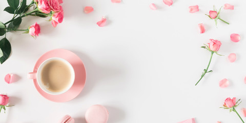 Flowers composition romantic. Flowers roses and rose petals, macaroon, cup coffee on white background. Happy women's day. Valentine's Day. Flat lay, top view 