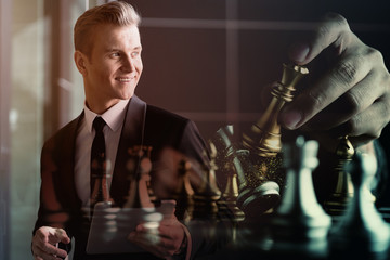 successful leader caucasian businessman  in suit with chess board challenge strategy metaphor ideas concept