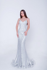 Beauty brunette model woman in evening dress. Beautiful fashion luxury makeup and hairstyle....