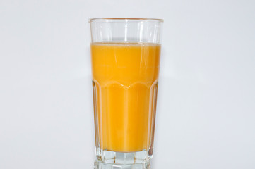 Orange juice glass, isolated on white background, horizontal format