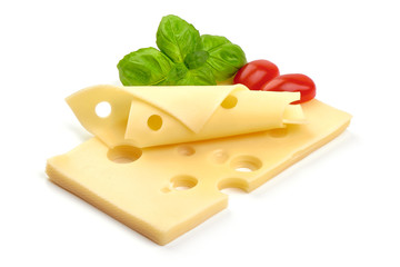 Maasdam cheese slices with basil and tomatoes, close-up, isolated on white background