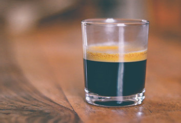 cup of coffee on a wooden table