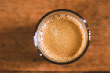 cup of coffee on a wooden table