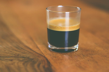 cup of coffee on a wooden table