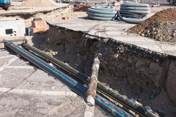 Construction industry. Road works. Excavation and laying of gas pipes. Laying of tubes for optical...