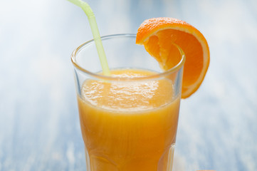Fresh orange juice cocktail on wooden background