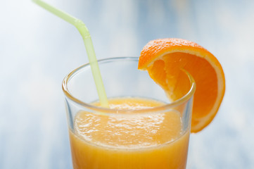 Fresh orange juice cocktail on wooden background