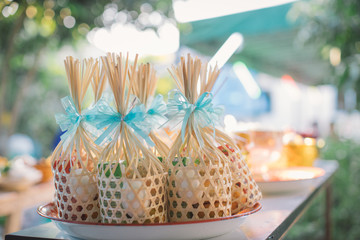 Offer food to monk. Groom give alms food to a Buddhist monk in traditional thai wedding ceremony. Hand while put food offerings in a Buddhist monk's alms bowl.Buddhists offer food in bowls.