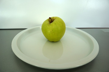 Fruit served on the tray and photographed on white plate