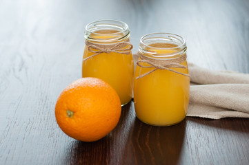 Orange juice in rustic style jars