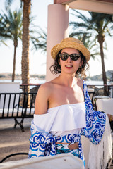 woman near pool in maiolica dress