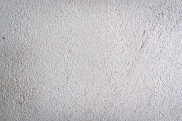 Texture of concrete wall surface painted with white color. Suitable for use as a pattern or background image for use in graphic design.