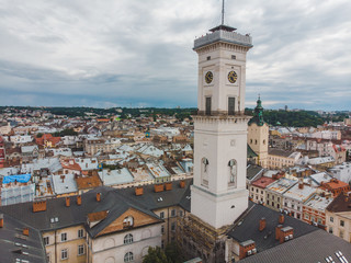 aerial view old european city with red roofs. city hall tower