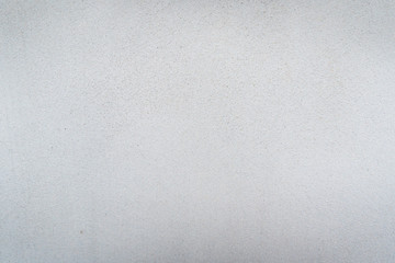 Texture of concrete wall surface painted with white color. Suitable for use as a pattern or background image for use in graphic design.