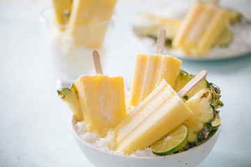 Homemade Pineapple Popsicles on a bowl(selective focus; close-up shot)