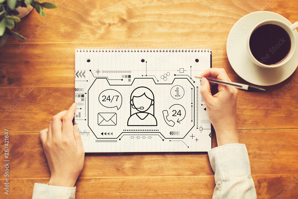 Poster customer service 24 hours 7 days a week with a person writing in a notebook on a wooden table
