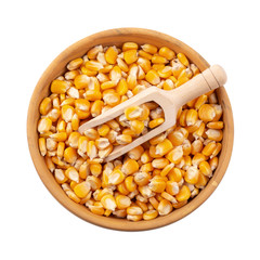 Corn seeds in a wooden bowl isolated on white background