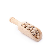 Black-eyed peas in a wooden bowl isolated on a white background