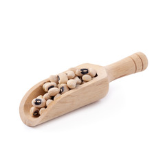 Black-eyed peas in a wooden bowl isolated on a white background