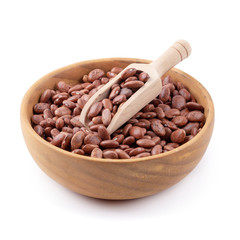 pinto beans in a wooden bowl isolated on a white background