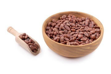 pinto beans in a wooden bowl isolated on a white background