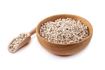 Millet rice in a wooden bowl isolated on white background