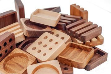 Assortment of wood handcraft pieces on white background