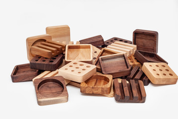 Assortment of wood handcraft pieces on white background