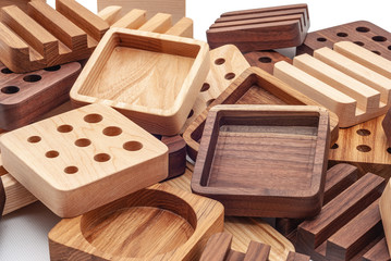 Assortment of wood handcraft pieces on white background